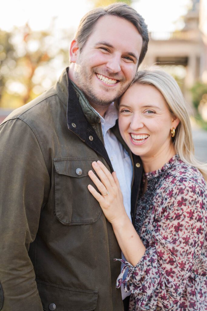 Couple laughs together at Gardencourt in Louisville for their engagement session