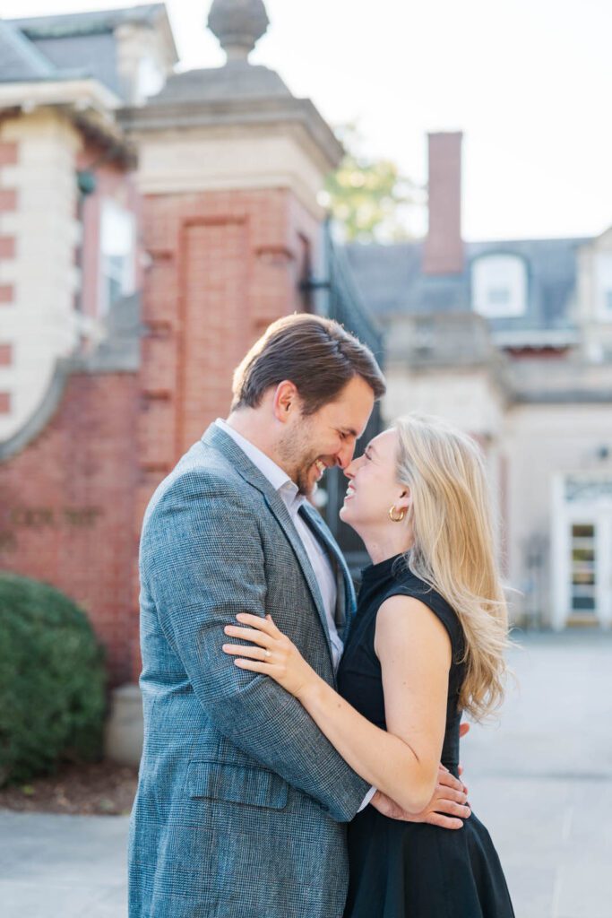 Couple smiles in front of their wedding venue, Gardencourt in Louisville, KY