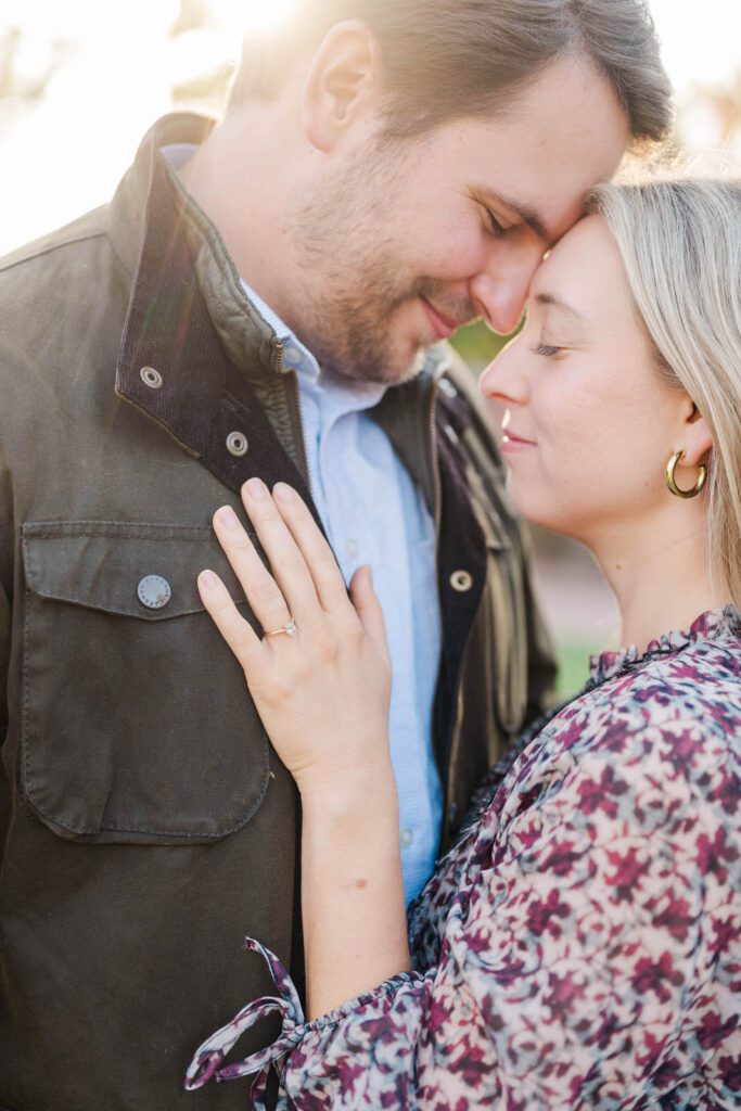 Engaged couple embraces during their engagement session at Gardencourt in Louisville