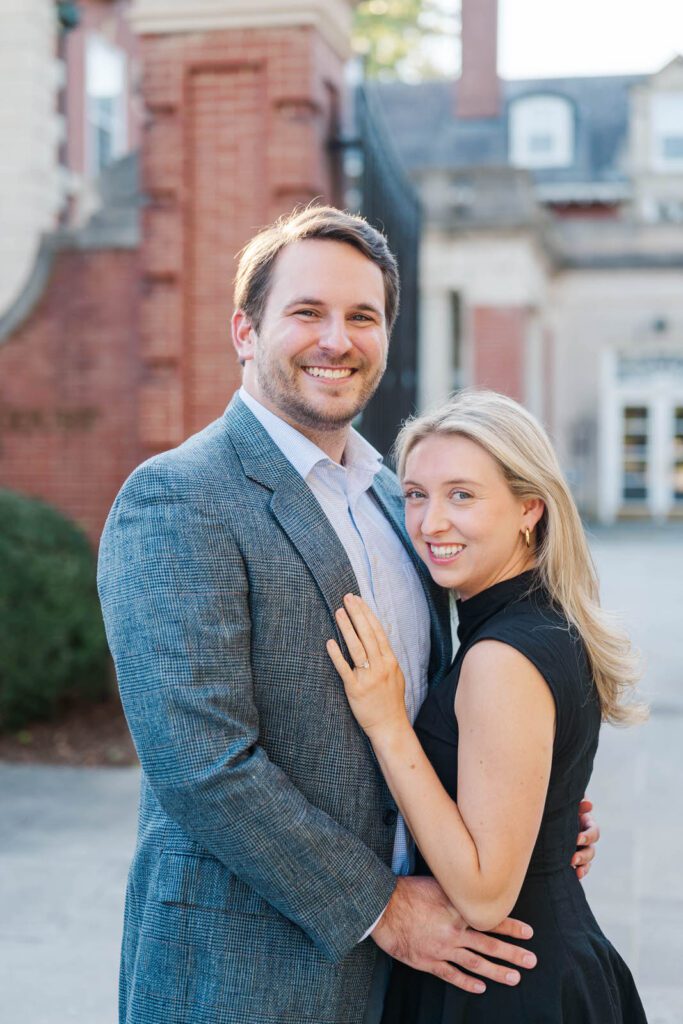 Couple stands together in front of Gardencourt in Louisville for their engagement session