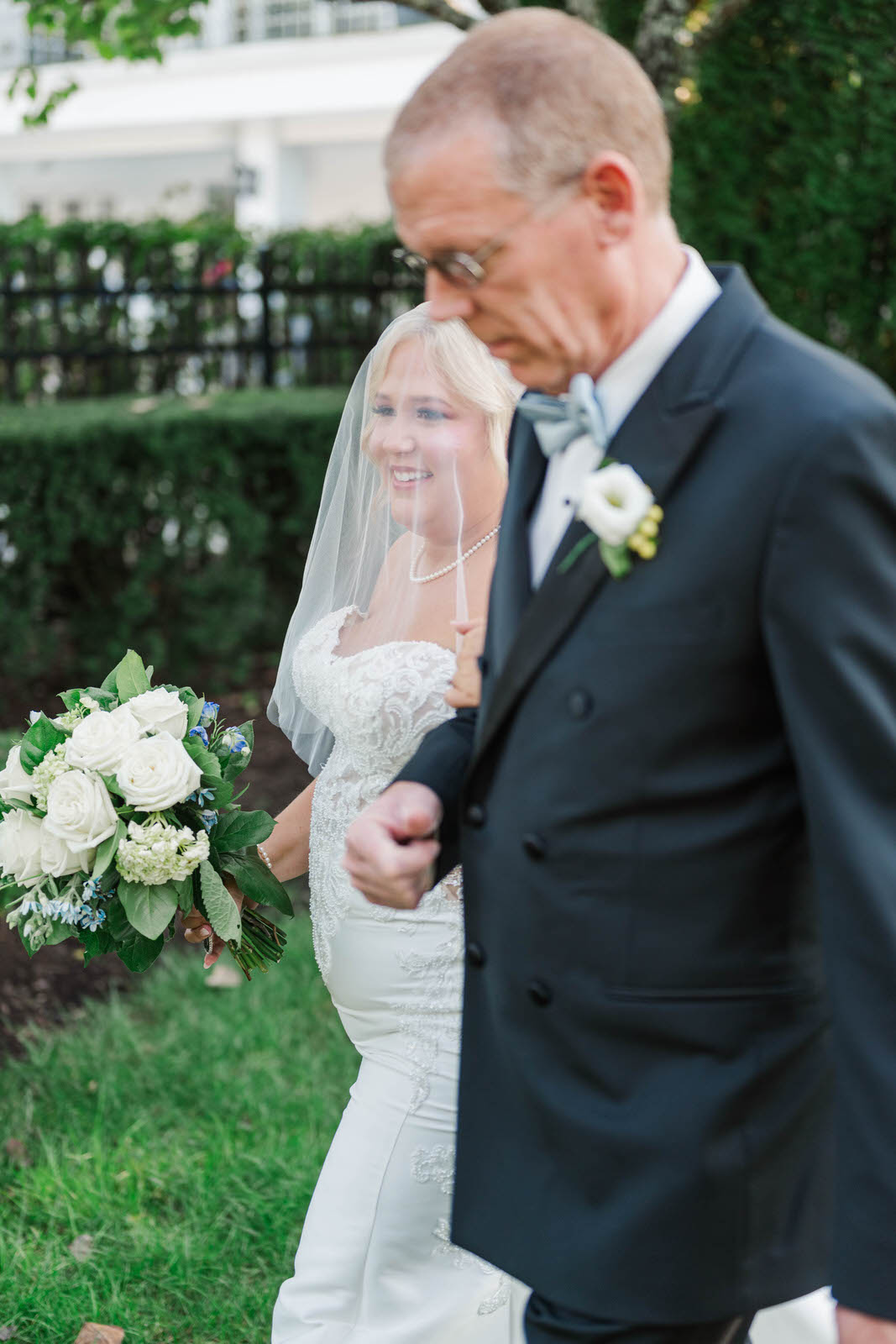 Bride walks down the aisle with her father on her wedding day