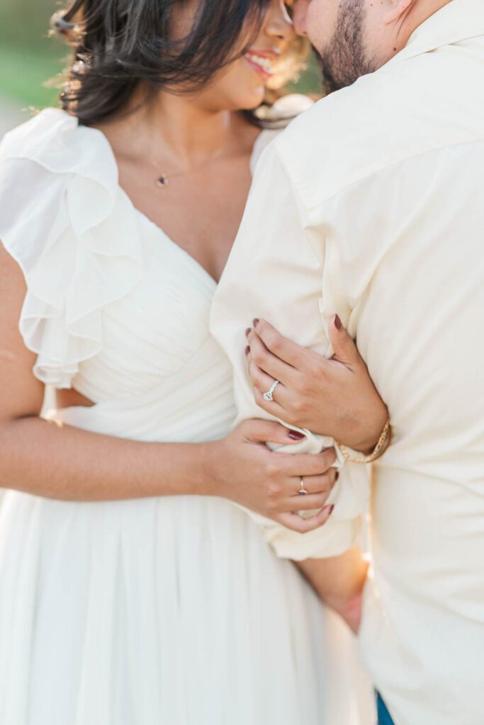 Couple stands close to one another during their engagement session at Beckley Creek Park in Louisville, KY