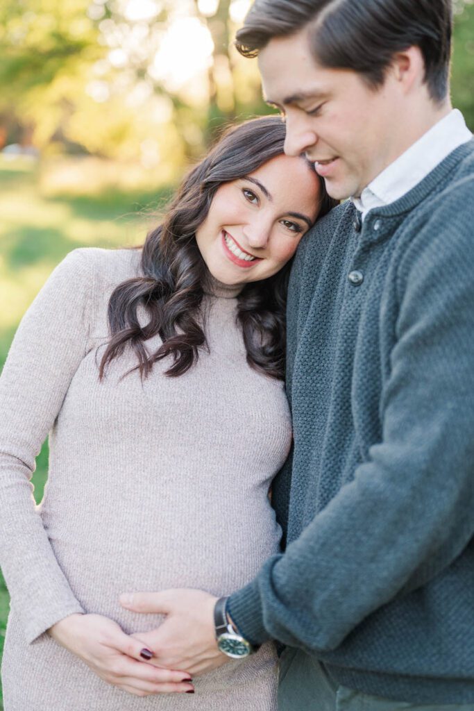 Couple smile at the camera during their Cherokee Park maternity session