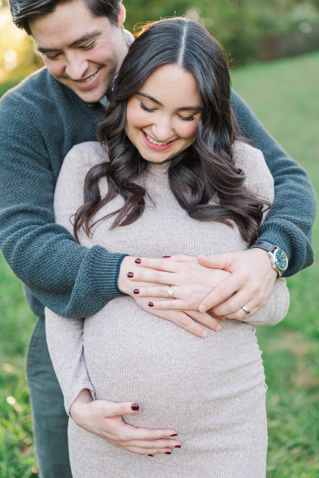 Couple embraces during their Cherokee Park maternity session