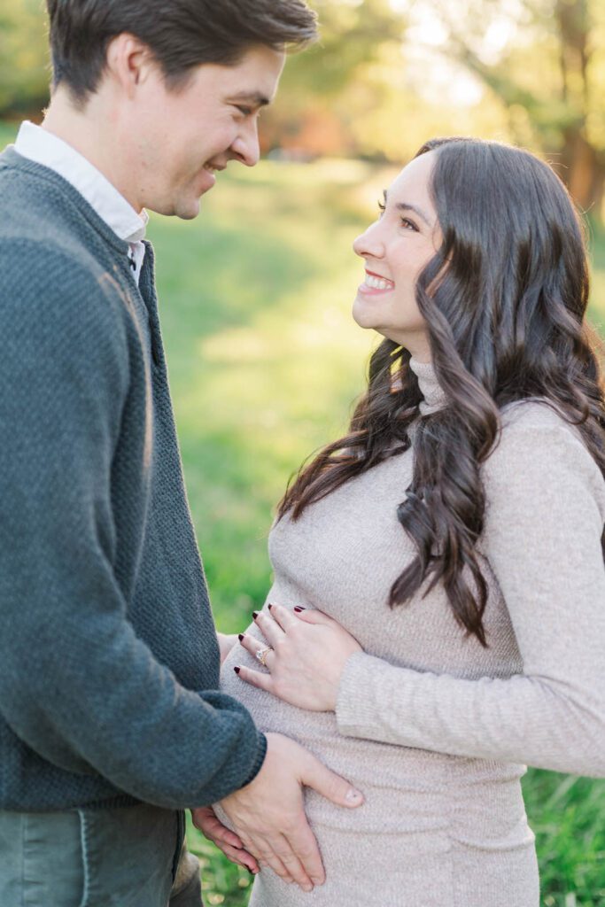 Couple embraces during their Cherokee Park maternity session