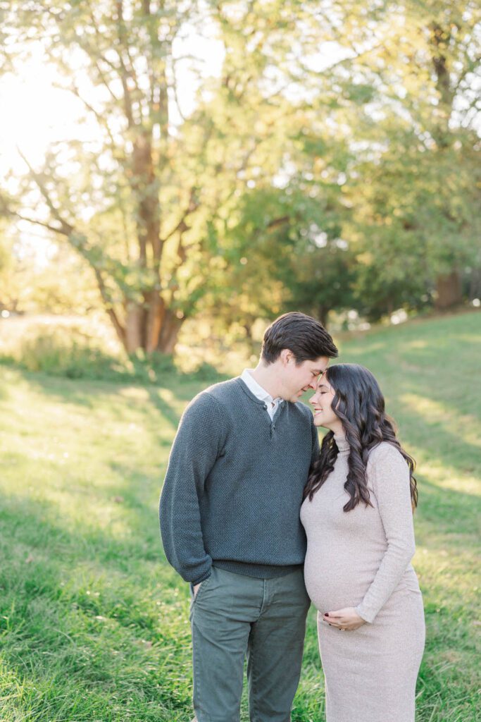 Couple embraces during their Cherokee Park maternity session