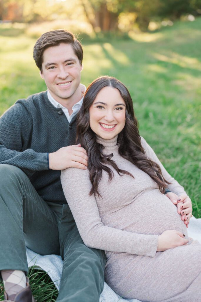 Couple embraces during their Cherokee Park maternity session