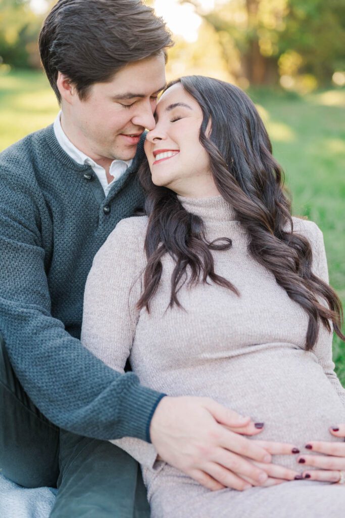 Couple embraces during their Cherokee Park maternity session