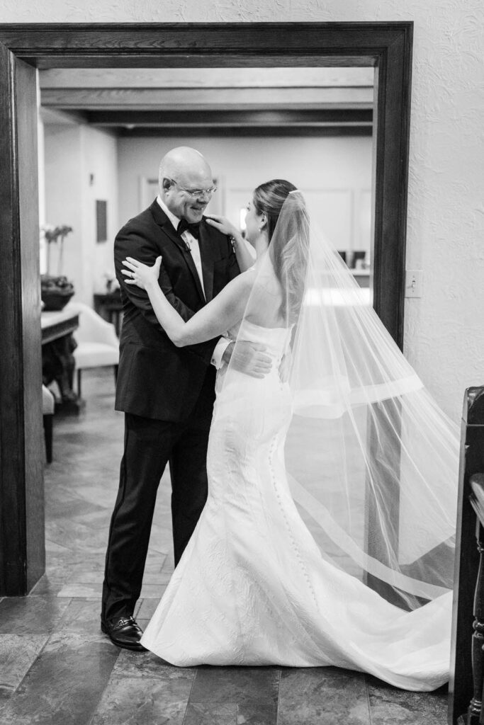 Bride hugs her father for first look before her wedding at The Kenwood Country Club in Cincinnati