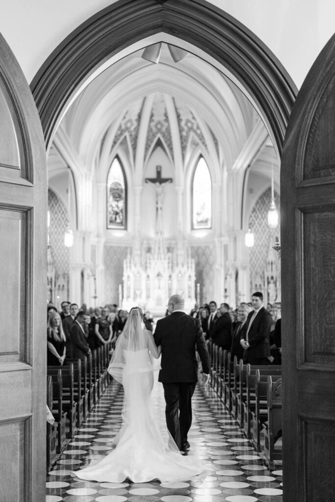 Bride and her father walk down the aisle for a wedding at Summit Country Day