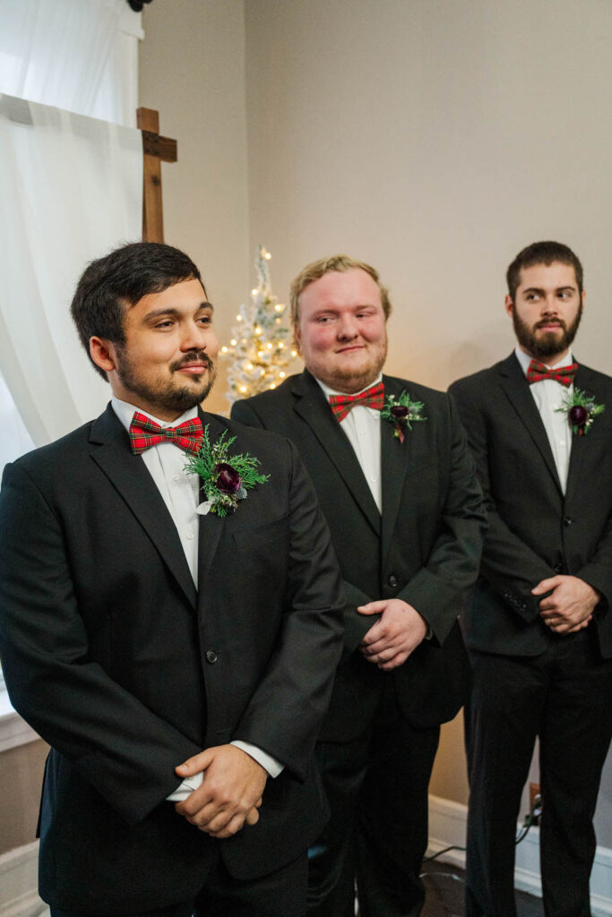 Groom watches bride walk down the aisle