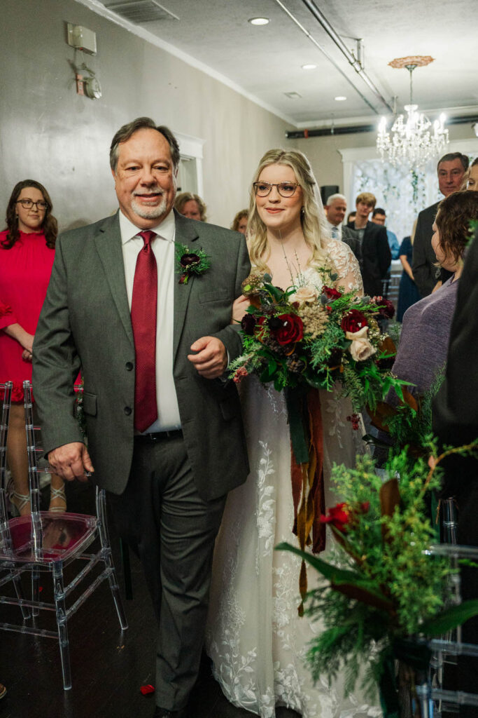 Bride walks down the aisle with her father