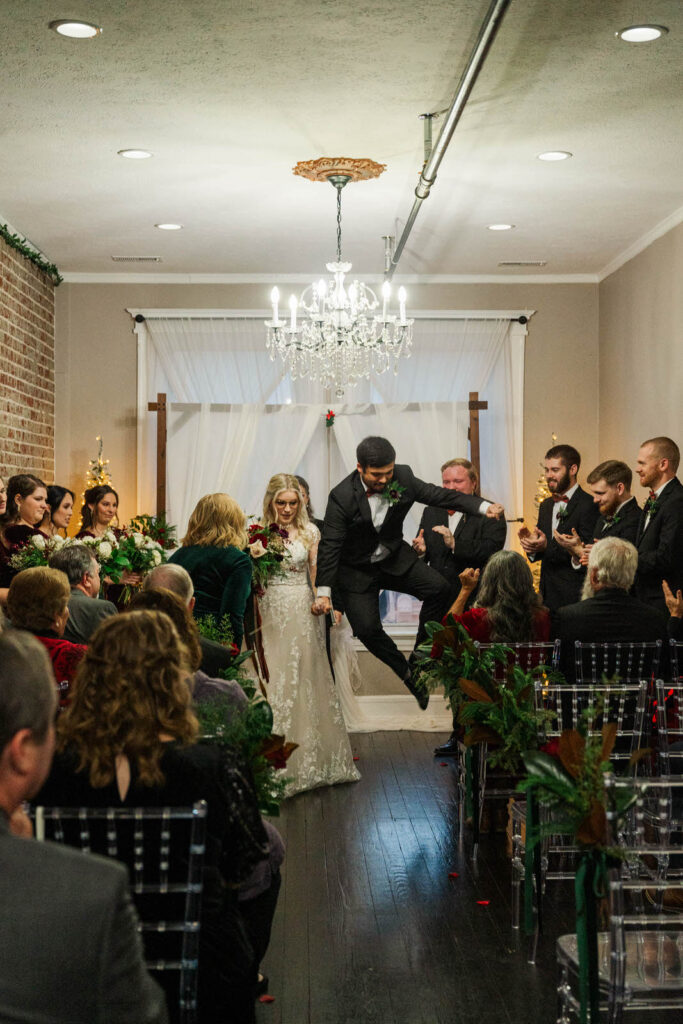 Groom jumps for joy after his wedding ceremony