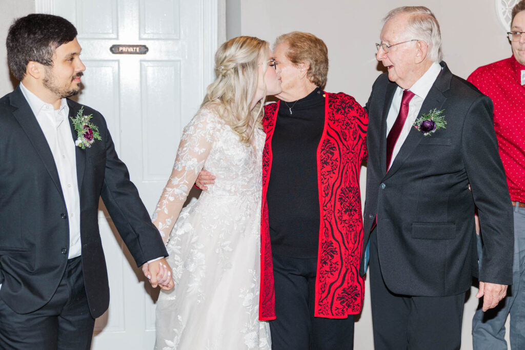 Bride and her grandma embrace after giving marriage advice following the anniversary dance