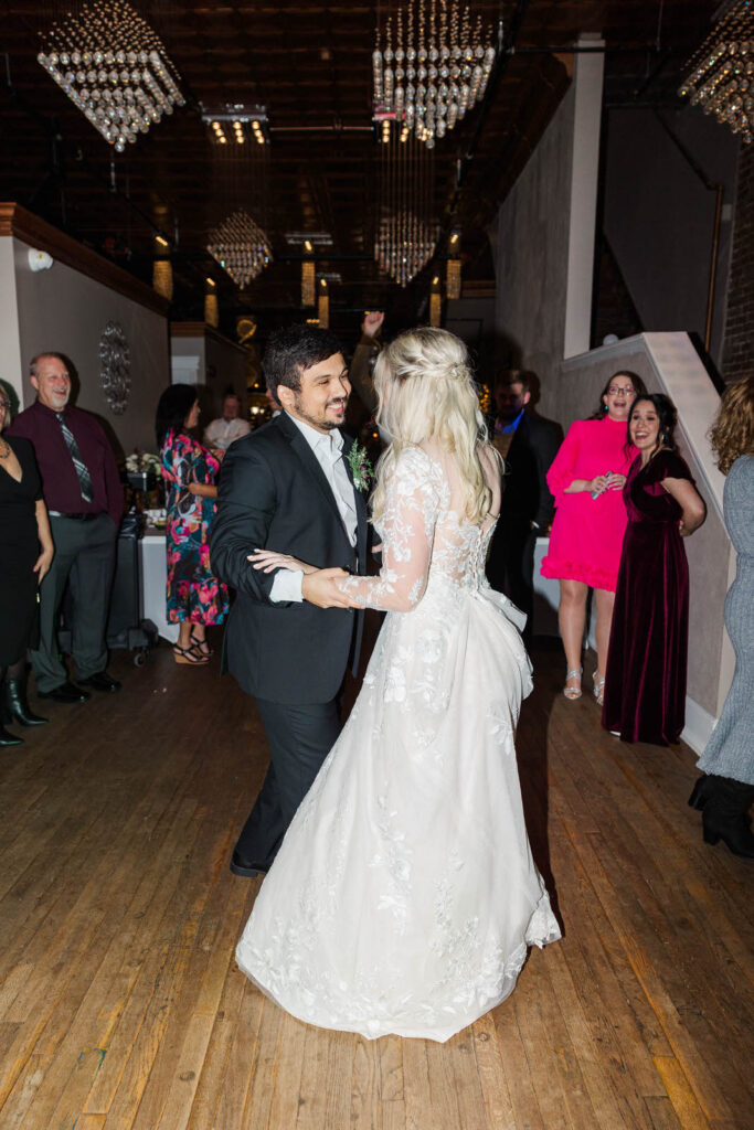 Bride and groom share a dance during their wedding reception at the Gatewood