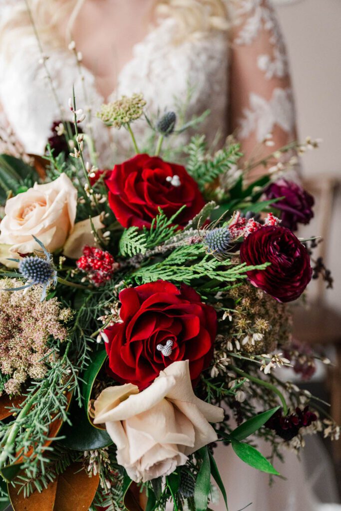 Bride holding a bouquet with personal touches by Louisville wedding planner, Palazzo Weddings and Events.