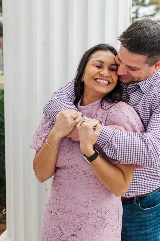 Couple embraces at the Marriott Griffin Gate for their engagement session.