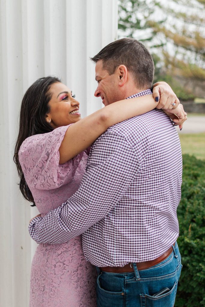 Couple embraces at the Marriott Griffin Gate for their engagement session.