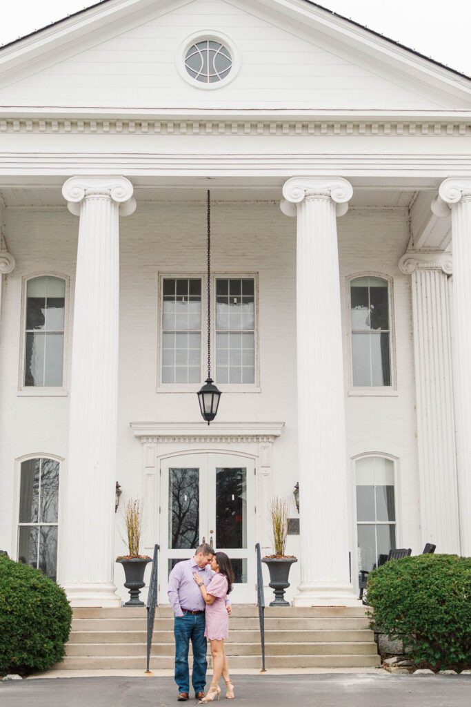 Couple stands in front of the Marriott Griffin Gate in Lexington for their engagement photos.