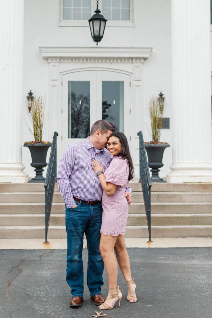 Couple stands in front of the Marriott Griffin Gate in Lexington for their engagement photos.