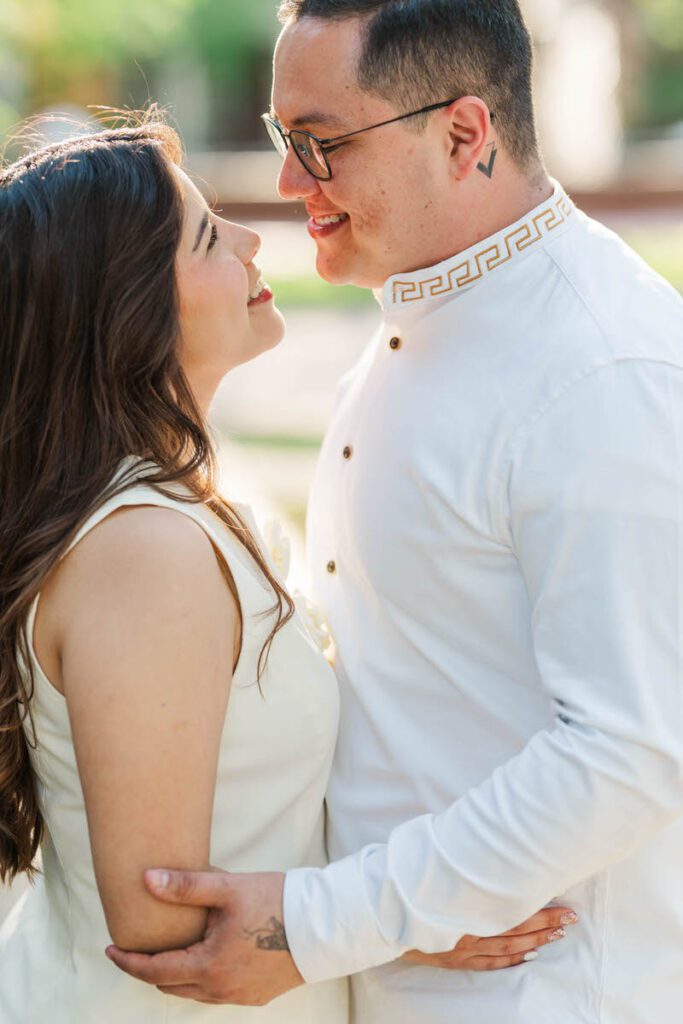 Couple embraces for their engagement session at Norton Commons in Louisville, KY