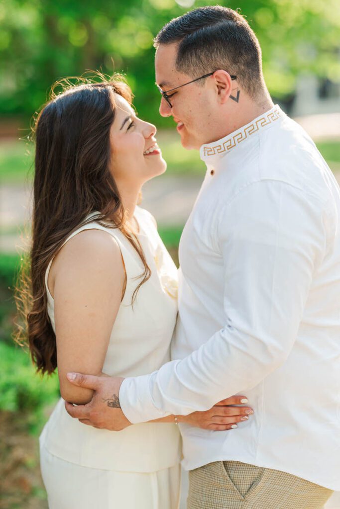 Couple embraces for their engagement session in Norton Commons