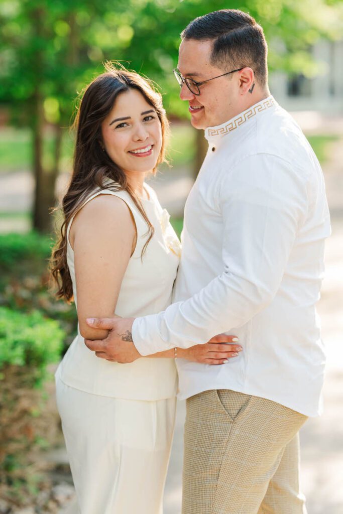 Couple embraces for their engagement session in Norton Commons