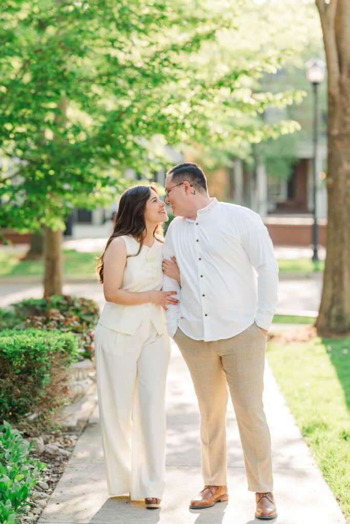 Couple embraces for their engagement session in Norton Commons