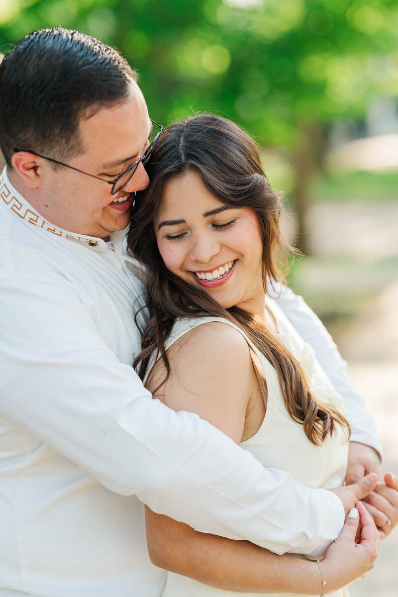 Couple embraces for their engagement session at Norton Commons in Louisville, KY