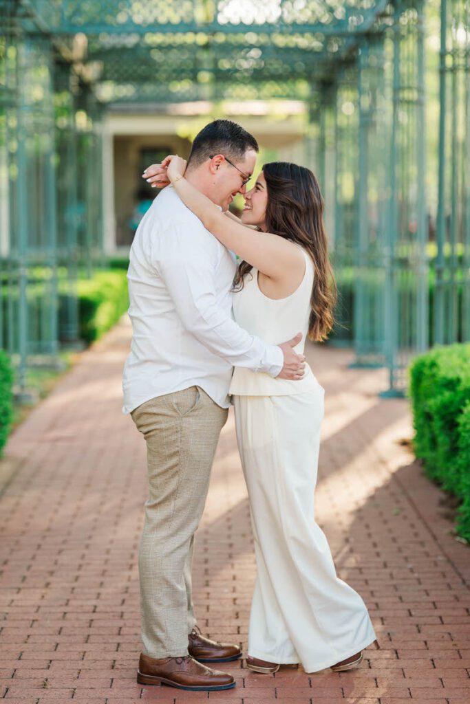 Couple embraces for their engagement session at Norton Commons in Louisville, KY