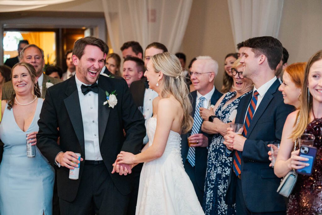 Bride and groom listen to the speeches at their Gardencourt wedding