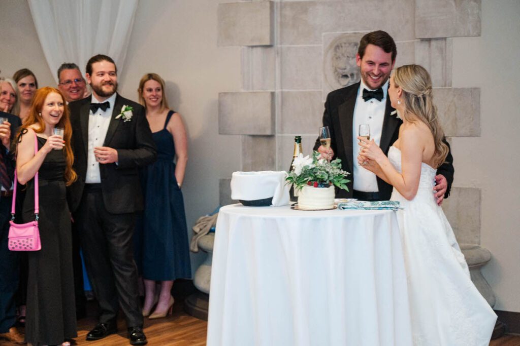Bride and groom listen to the speeches and toast champagne at their Gardencourt wedding in Louisville, KY