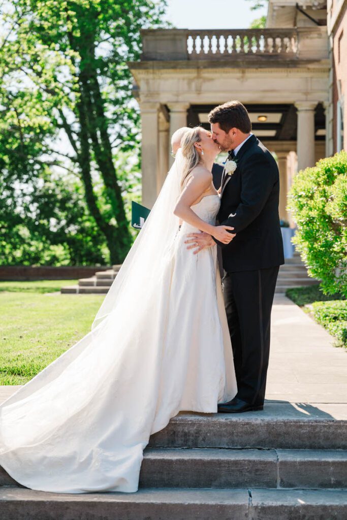 First kiss at a wedding ceremony at Gardencourt in Louisville, KY