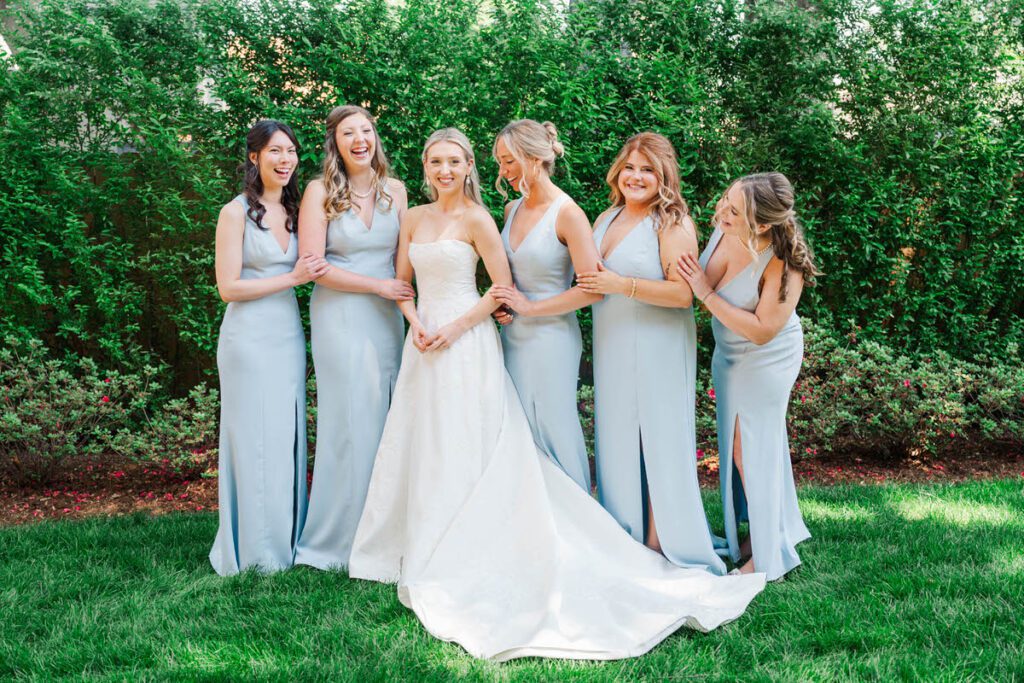A bride's first look with her bridesmaids after she got in her wedding dress