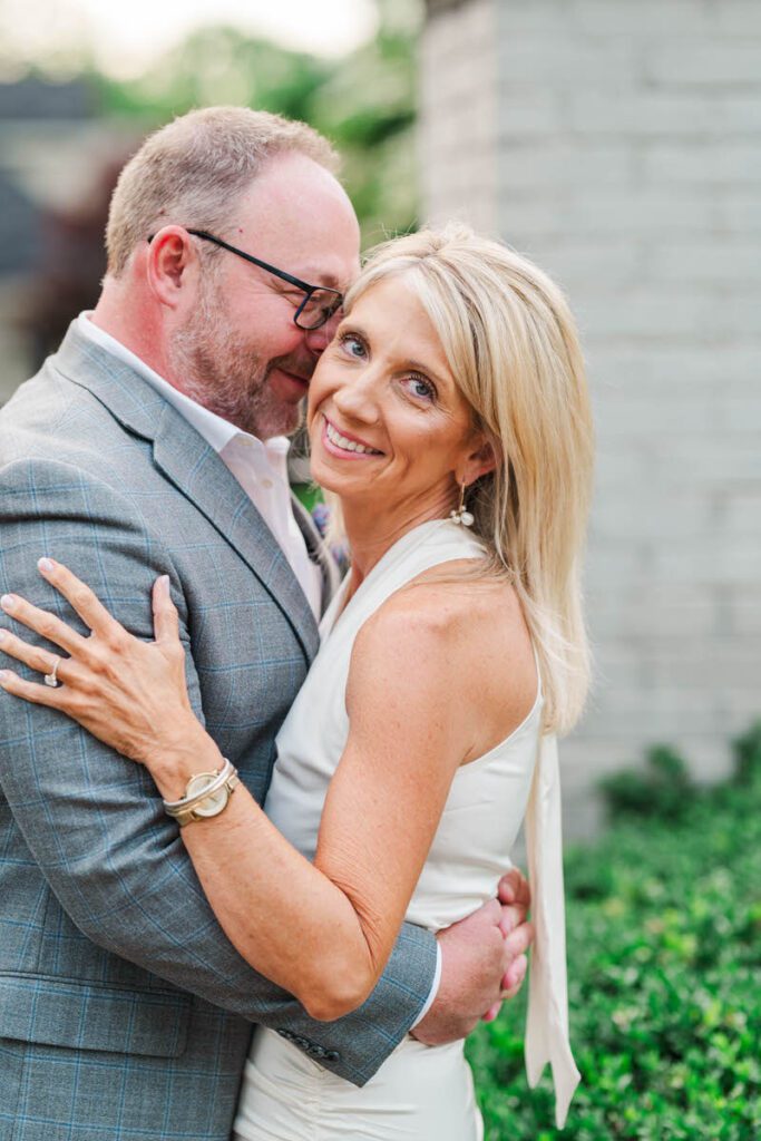 Couple embraces for their engagement session at Gratz Park in Lexington, KY