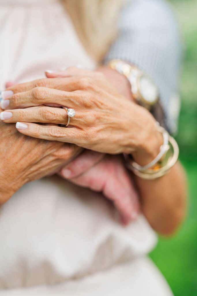 Couple holds hands at their Gratz Park engagement session.