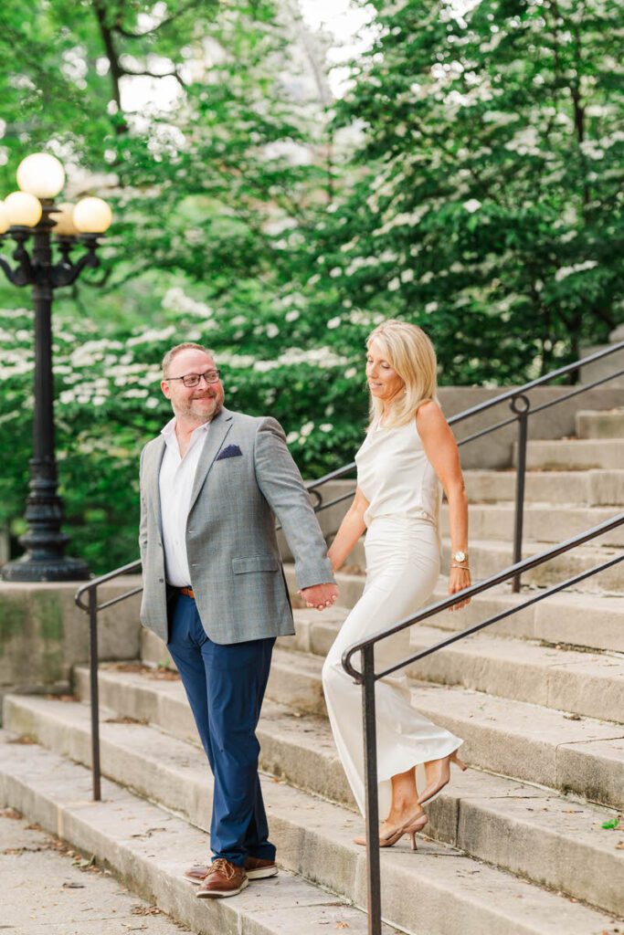 Couple walks together holding hands in Gratz Park