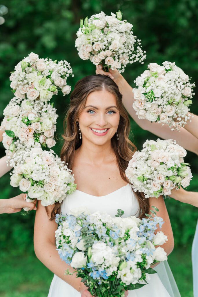 Bride surrounded by flowers at a Gheens Foundation Lodge Wedding