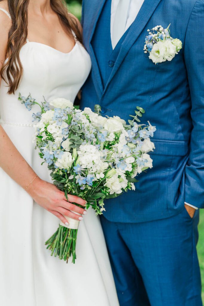 Newlyweds stand together for a portrait at their Gheens Foundation Lodge wedding
