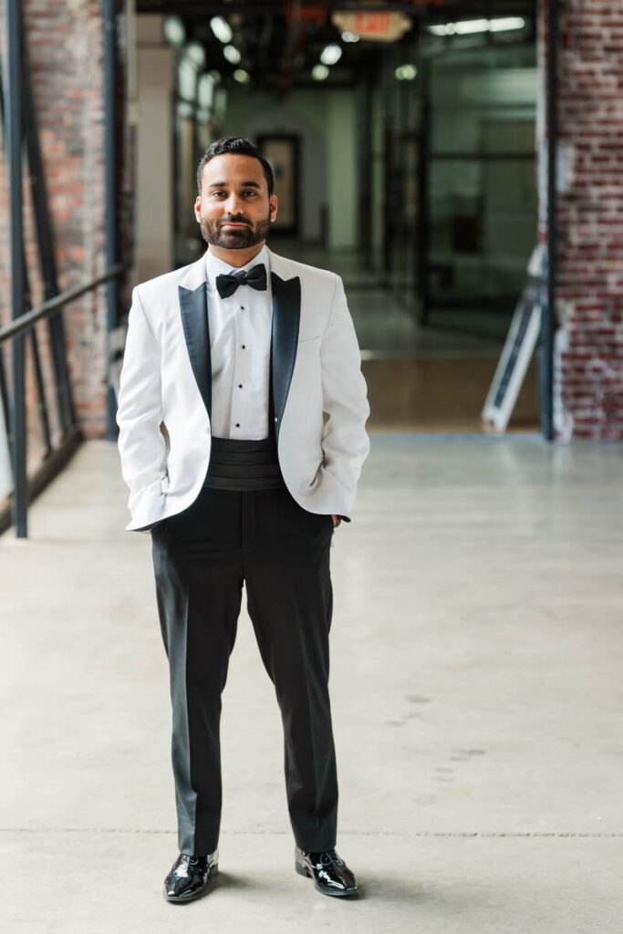 Groom waiting for the first look for his wedding day at Mellwood Art Center