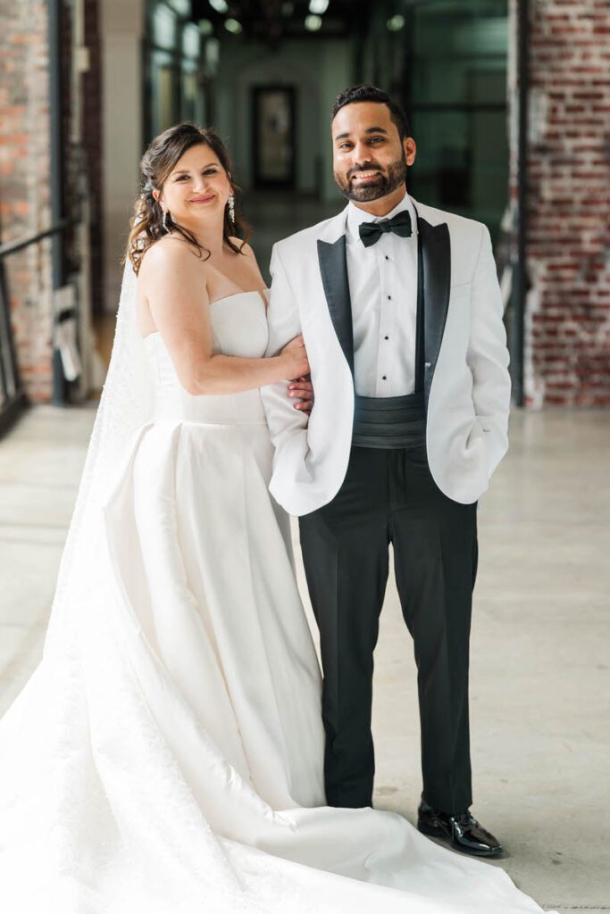 Couple stands together after their first look, preparing for their wedding day at Mellwood Art Center in Louisville, KY.
