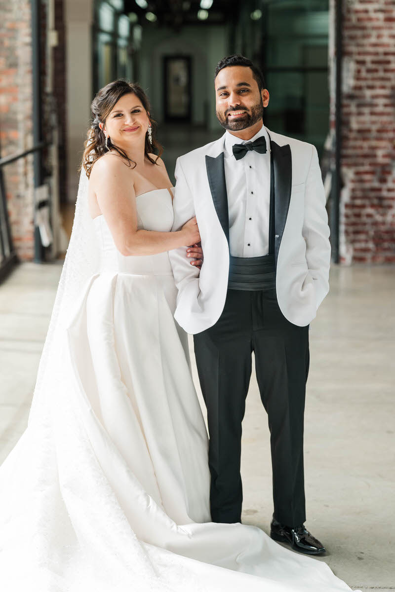 Couple stands together after their first look, preparing for their wedding day at Mellwood Art Center in Louisville, KY.