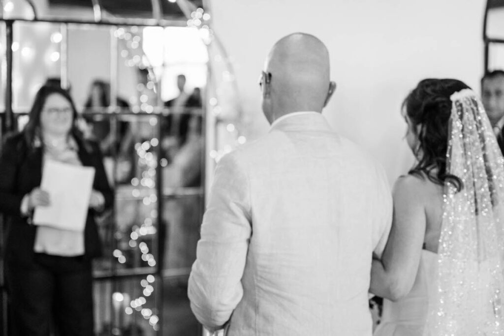 Bride and her father walk down the aisle at Mellwood Art Center