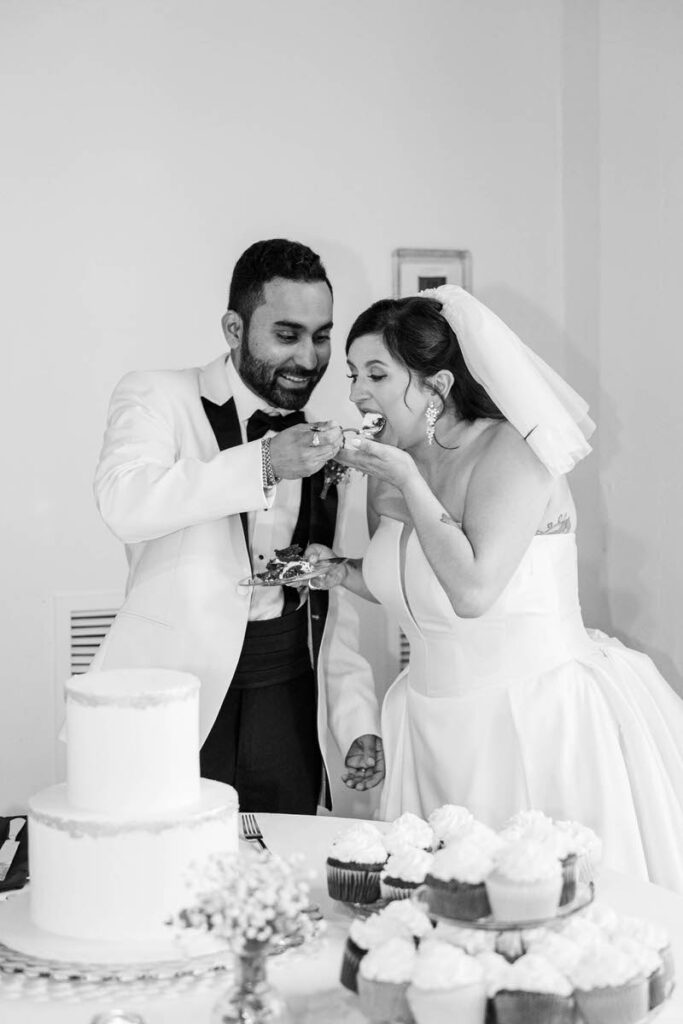 Bride and groom cut the cake for their wedding at Mellwood Art Center