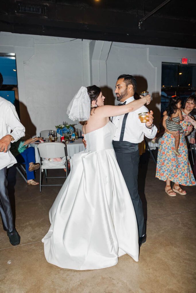 Bride and groom dance together on a wedding day at Mellwood Art Center