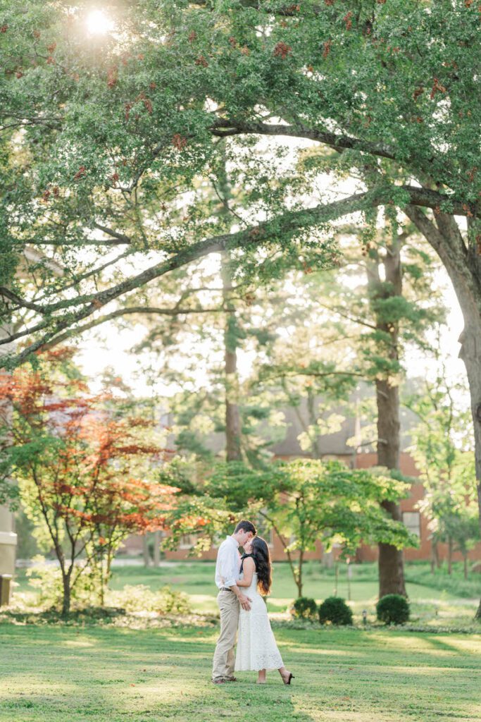 Couple embrace during their engagement session at Anchorage Trail
