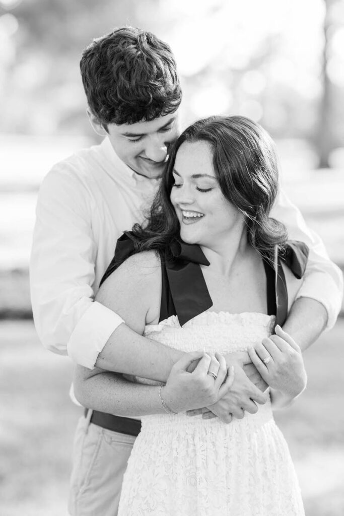 Couple laugh at Anchorage Trail during their engagement session in Louisville, KY