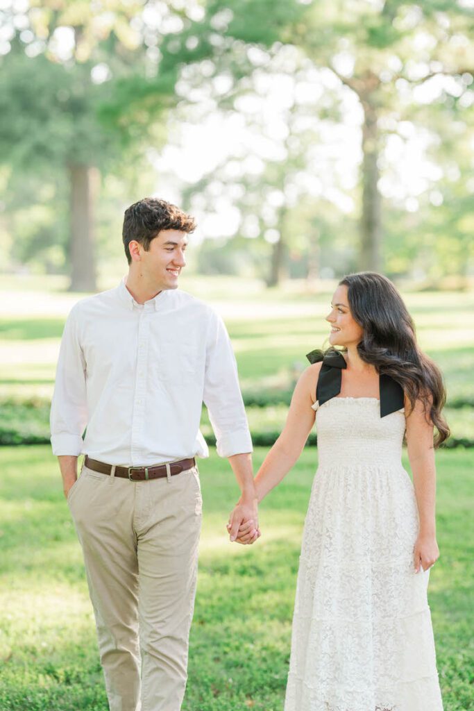 Couple walk together at Anchorage Trail for their engagement session