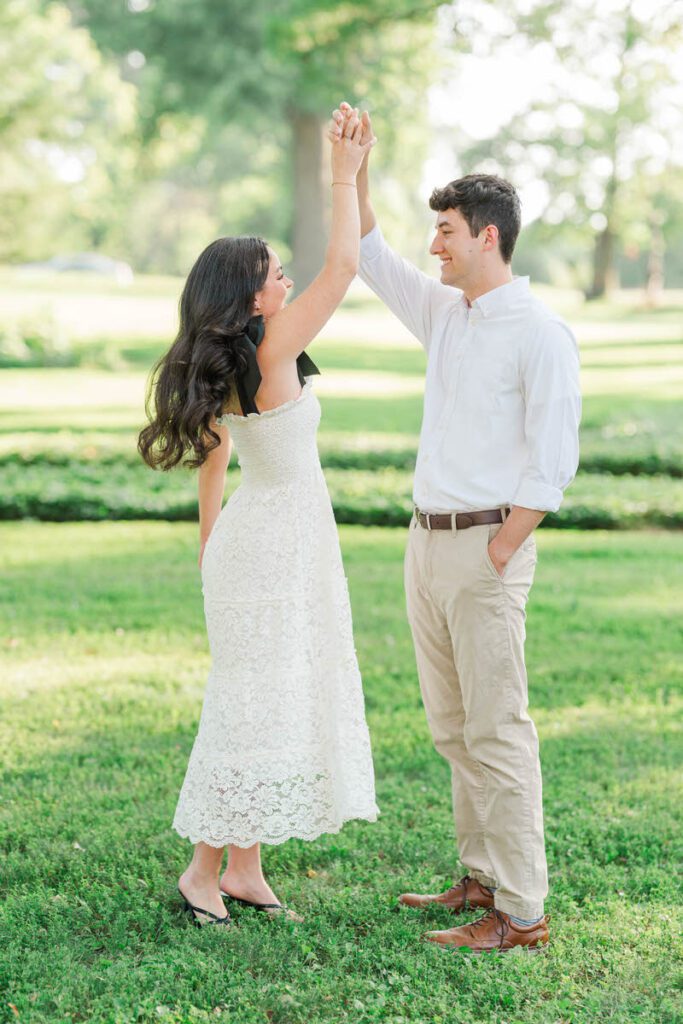Couple twirls at Anchorage Trail for their engagement session in Louisville, KY