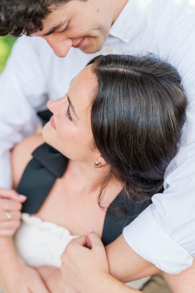 Couple smile at each other at Anchorage Trail during their engagement session in Louisville, KY